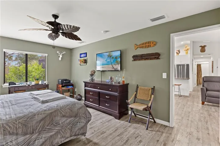 Primary bedroom has LVT flooring as does the rest of the home.