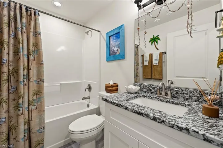 Guest bathroom with granite counter top.
