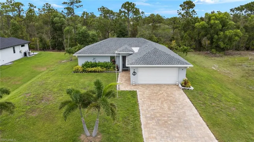 Beautiful newer home with pavered drive and entryway.