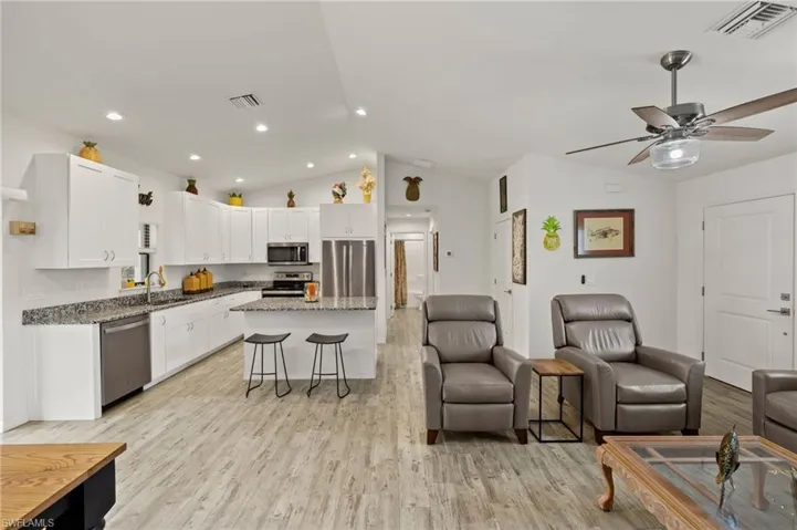 Can lighting in the kitchen and a window over the sink keep things light and bright.