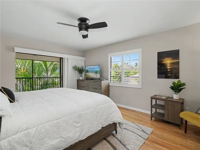Bedroom featuring wood-finish flooring and neutral wall tones