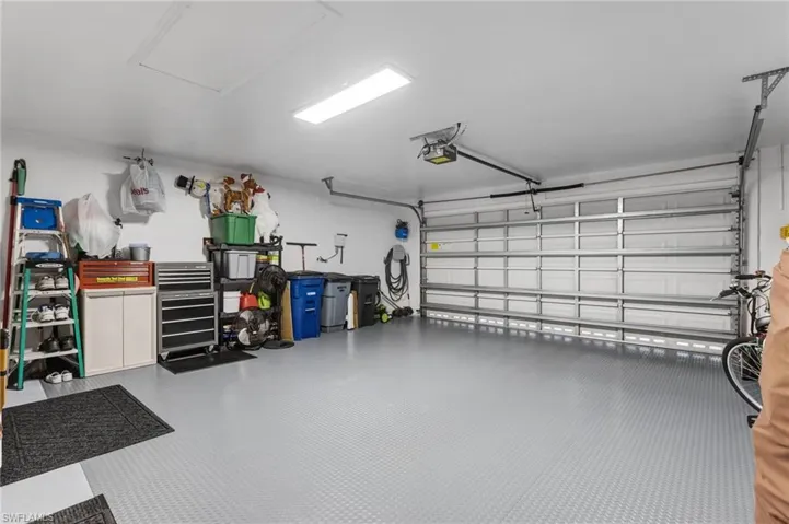 Garage featuring a garage door opener