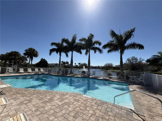 Community pool featuring a patio