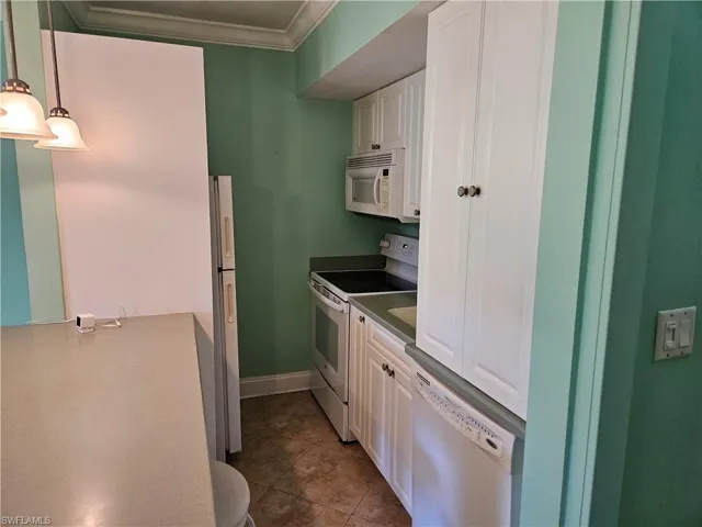 Efficient kitchen with full size stove and dishwasher