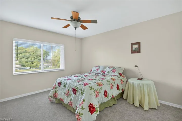 Bedroom featuring carpet and a ceiling fan