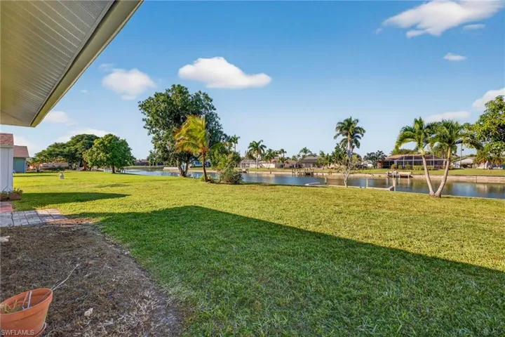 View of grassy yard featuring a water view