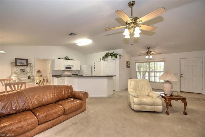 This view is from the lanai looking back toward the kitchen and the family dining area near the entry. You can also see the pantry located in the kitchen area.