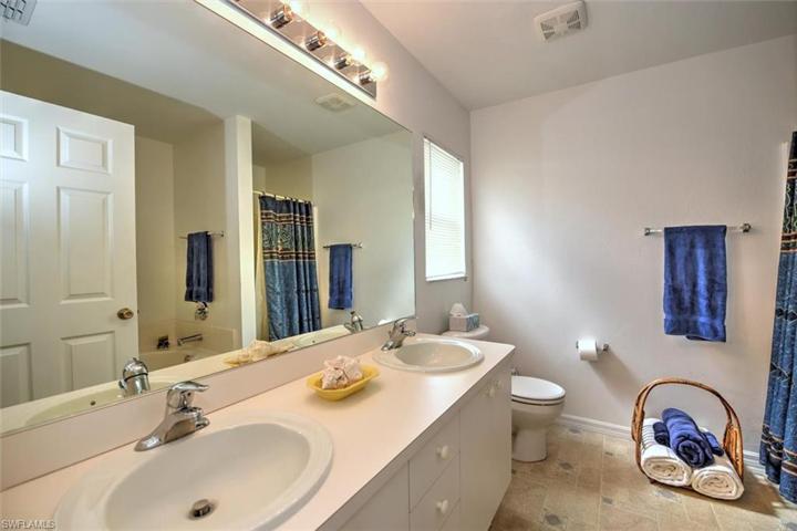 Master bath with dual sinks, a separate garden tub and shower.