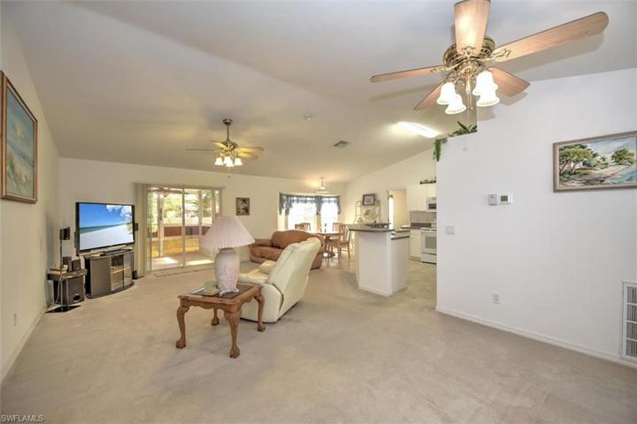 This view is from the entry. You will love the open split floor plan with vaulted ceilings as you enter.