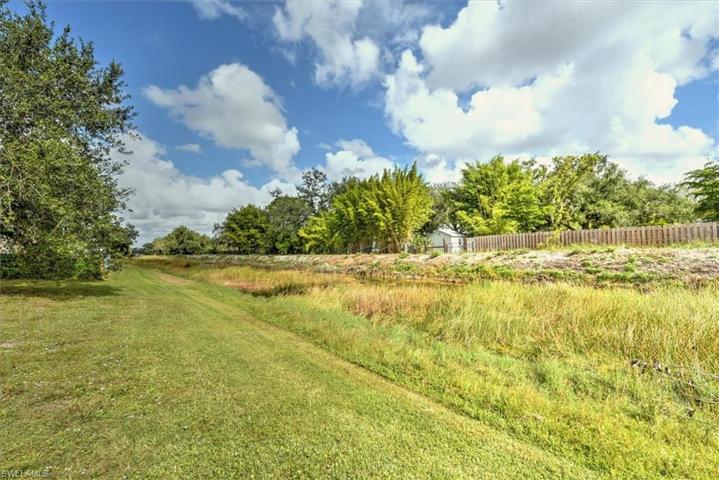 Canal view from the back yard which serves as a great buffer behind the home. The properties beyond the canal are acreage properties so no direct neighbors behind you here. Perfect for watching lots of species of birds, Eagles, cranes, and more.