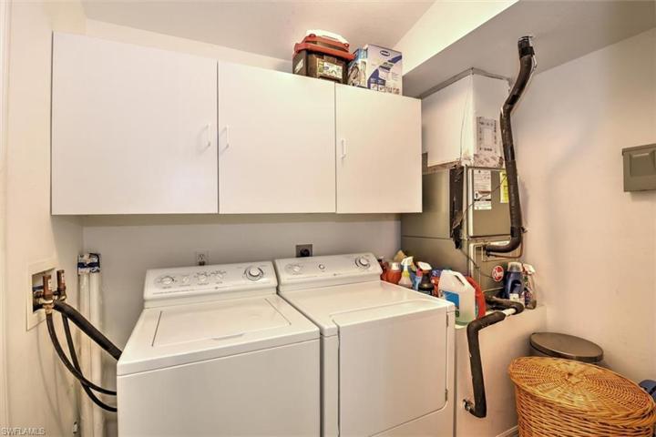 The laundry room has extra storage just off the kitchen and the air handler is located in the corner which helps extend the life of your air conditioner being in the climate controlled environment instead of in the garage or attic.  Your AC tech will love doing service for you on this one!