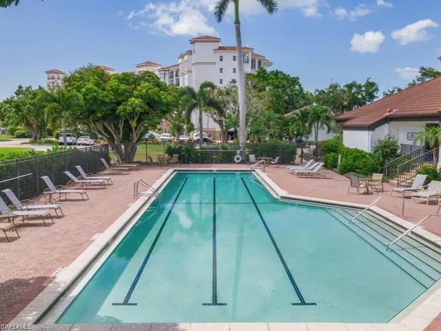 Community pool featuring a patio