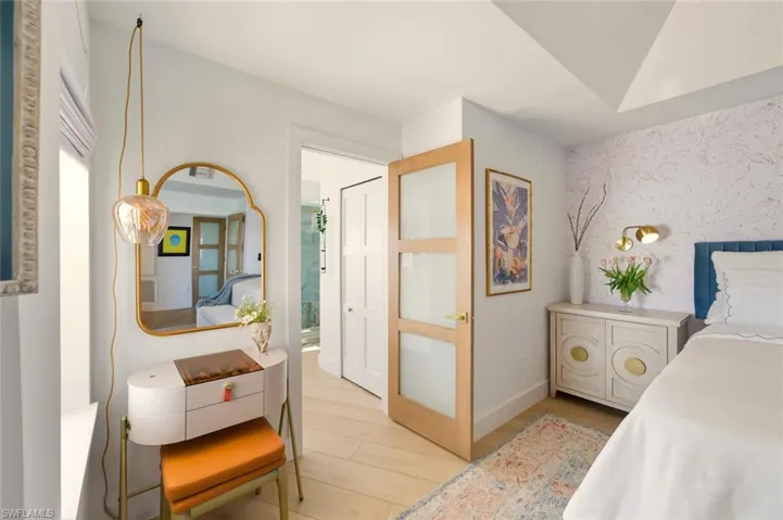 Bedroom featuring light wood finished floors and baseboards