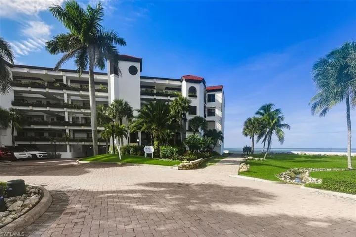 View of apartment building / complex featuring a water view