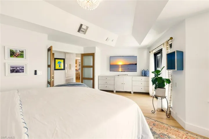 Bedroom with light wood-type flooring and baseboards