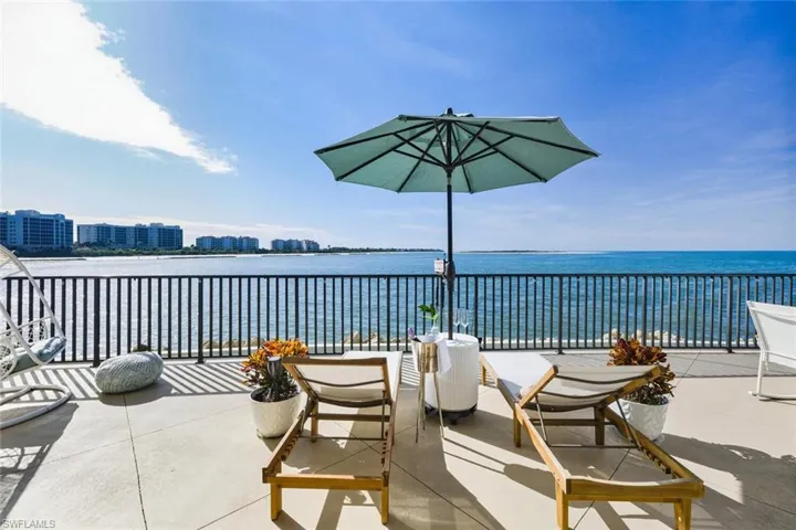 View of patio with a water view