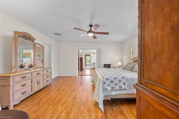 Bedroom featuring light wood-type flooring and ceiling fan