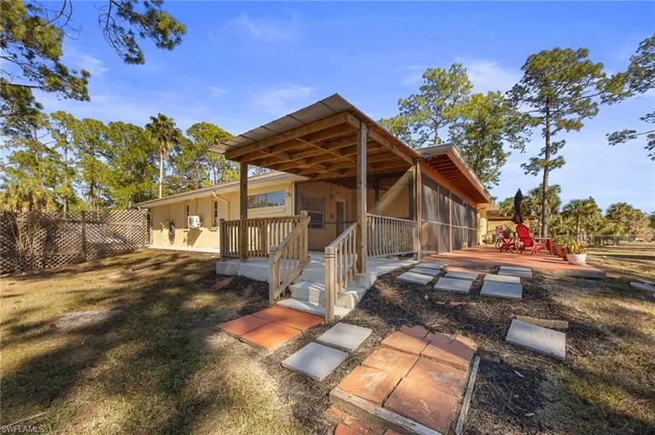 Back of property with a deck