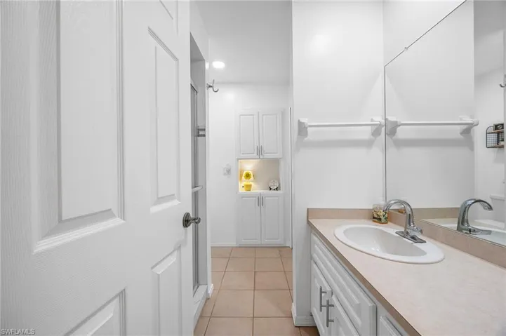 Bathroom featuring vanity and light tile patterned flooring