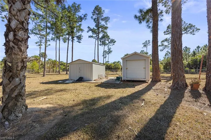 View of yard featuring a storage unit