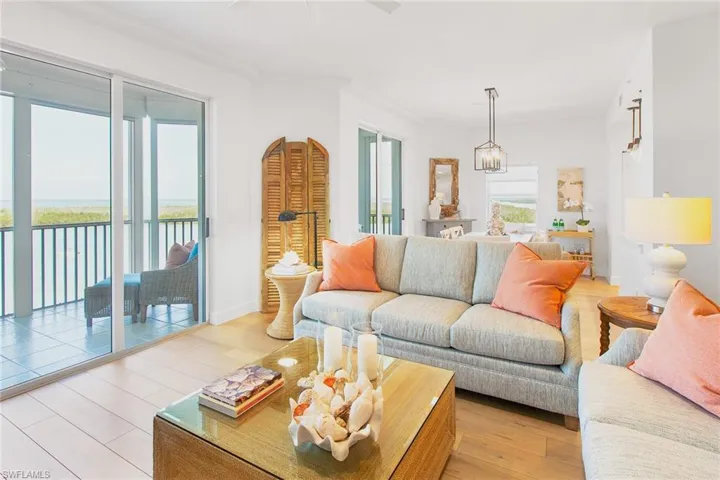 Living area featuring ceiling fan and light wood-style flooring