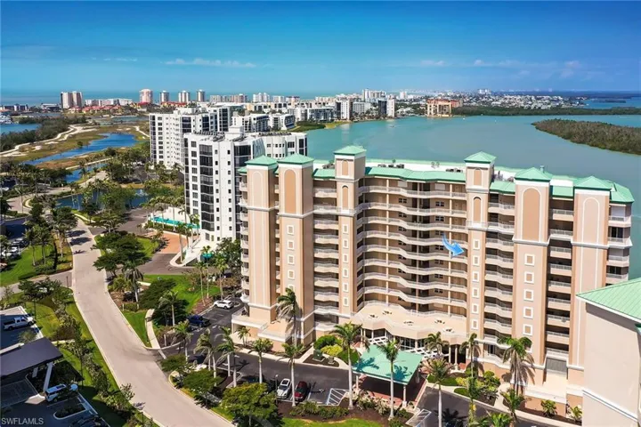 View of property with a view of city and a water view