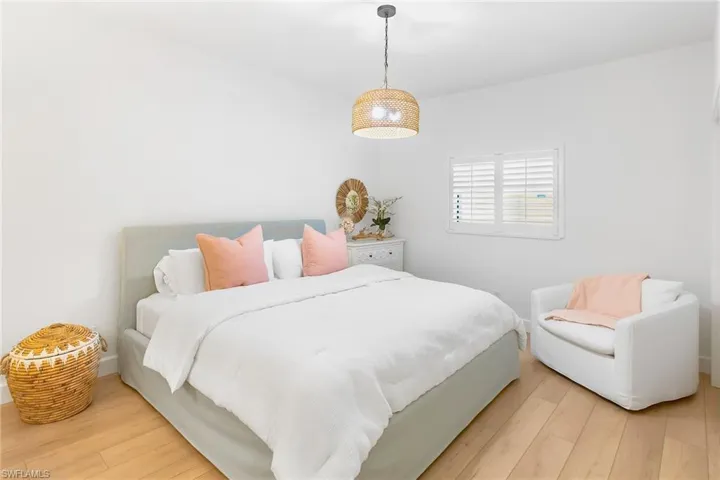 Bedroom with hardwood / wood-style floors