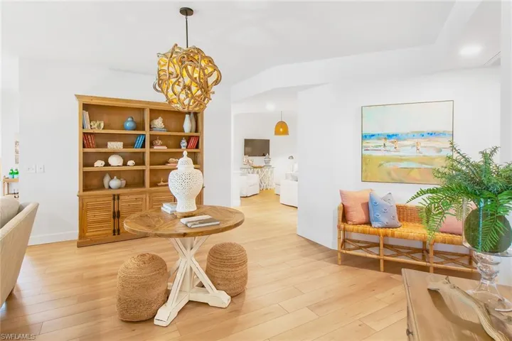Sitting room featuring a chandelier, recessed lighting, baseboards, and light wood-style floors