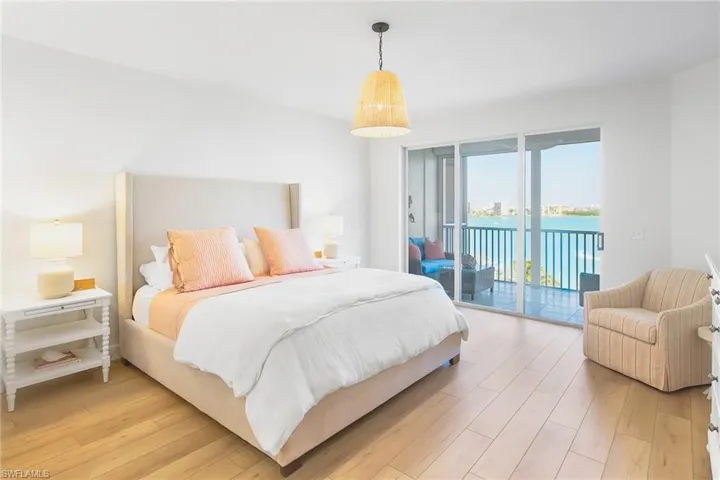 Bedroom featuring light wood-type flooring and access to outside