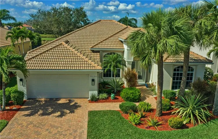 Mediterranean / spanish-style home with a garage