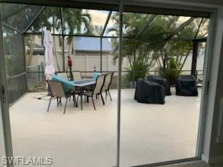 Large lanai to relax. Sliders have storm shutters