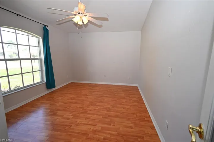 Spare room with light wood-style floors and ceiling fan