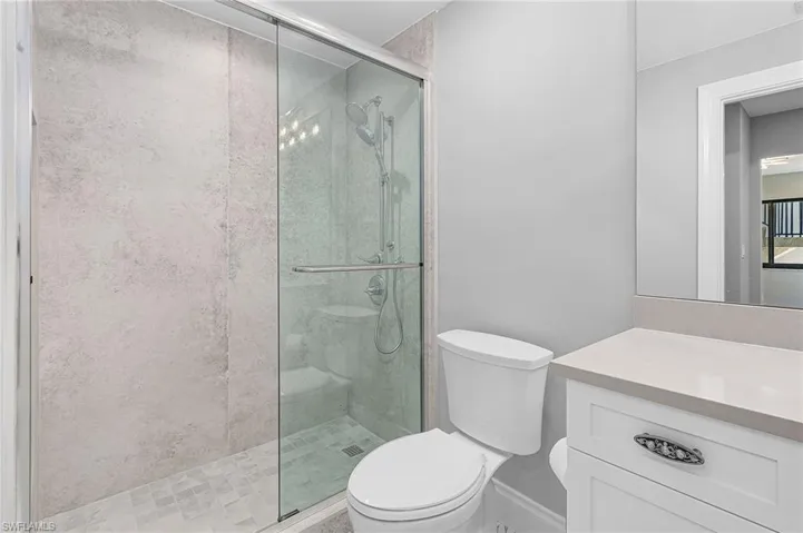 Full bathroom with a stall shower and vanity