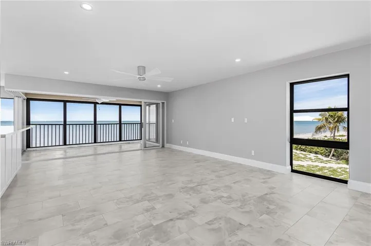 Unfurnished room featuring a water view, plenty of natural light, recessed lighting, and a ceiling fan
