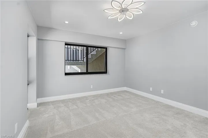 Unfurnished room featuring light colored carpet and recessed lighting