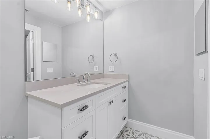 Bathroom featuring vanity and light tile patterned flooring