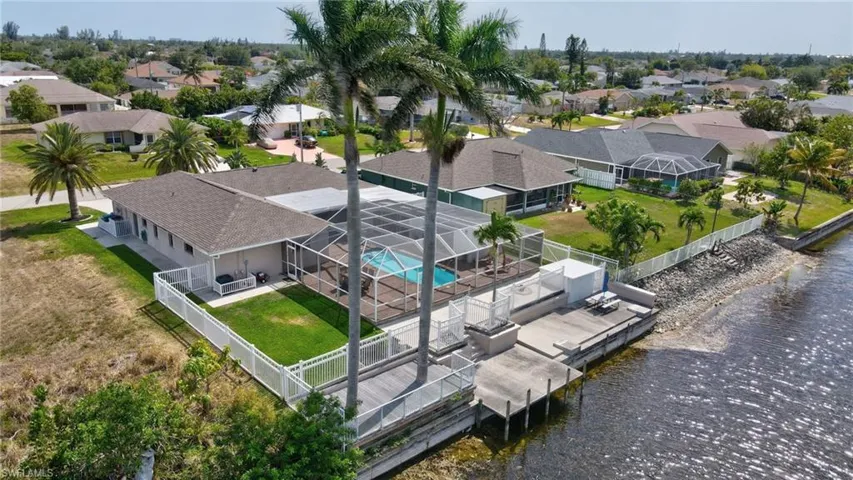 Drone / aerial view with a residential view and a water view