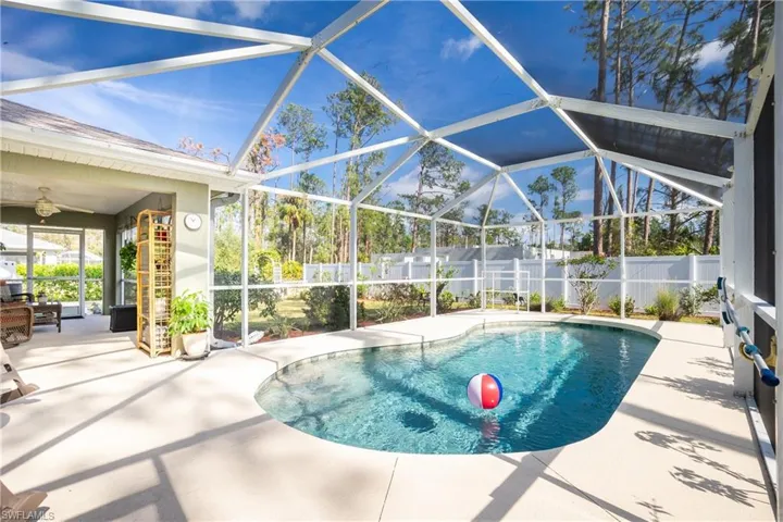 View of pool featuring a lanai, a fenced backyard, a fenced in pool, and a patio