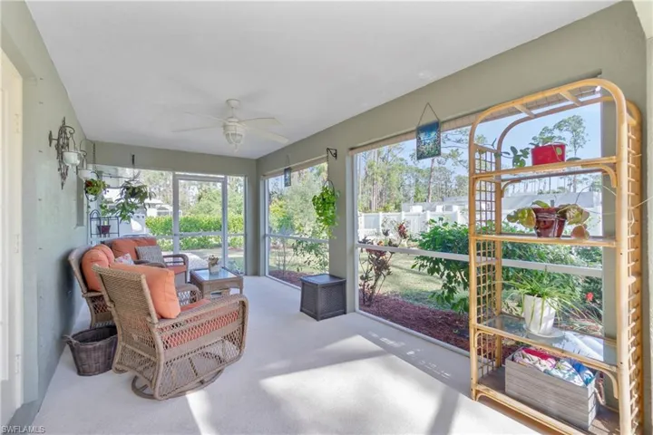Sunroom / solarium featuring ceiling fan