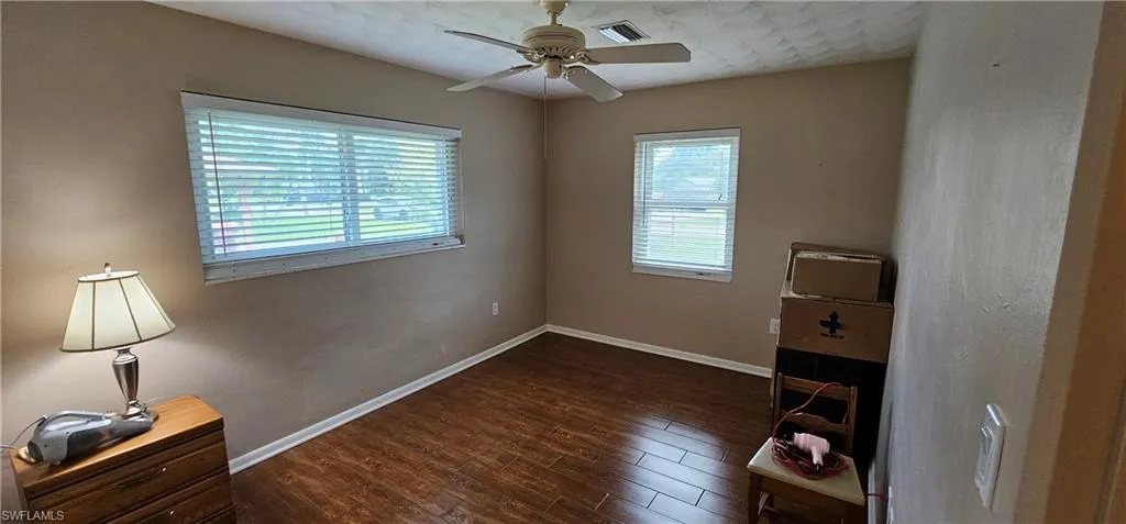 Doorway to property featuring a garage and stucco siding