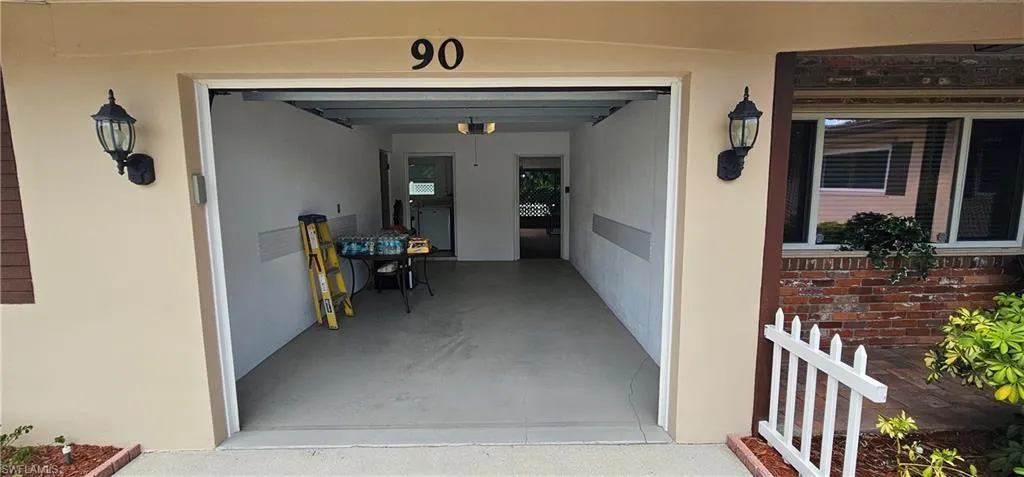 Unfurnished bedroom with multiple windows, wood finished floors, and a ceiling fan