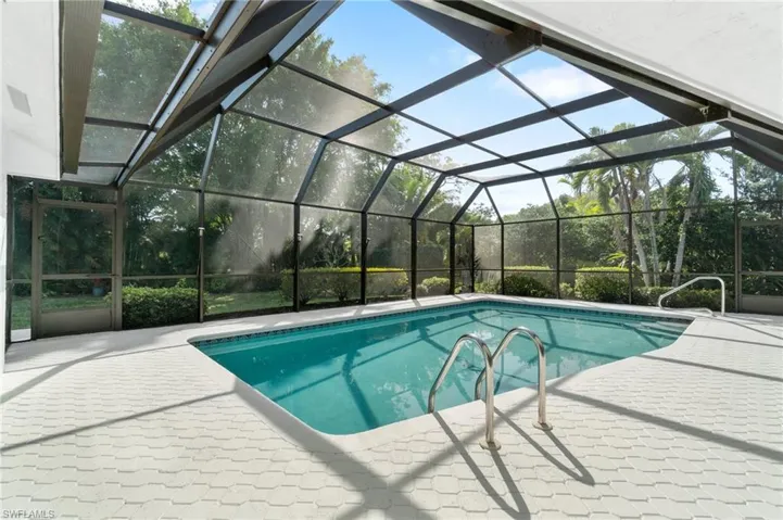 Pool featuring a lanai and a patio