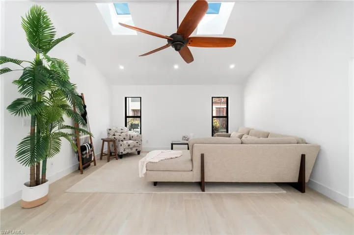 Living area with plenty of natural light, and a skylight