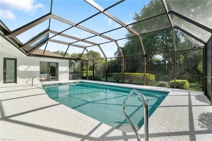 Pool featuring a lanai and a patio area