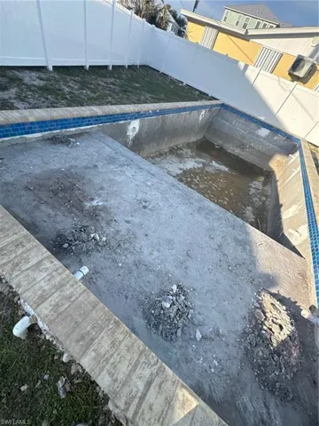 View of pool with a fenced backyard