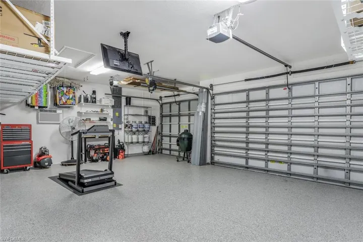 3 car Garage Brand New Epoxy Floor and Plenty of above head and side storage space.