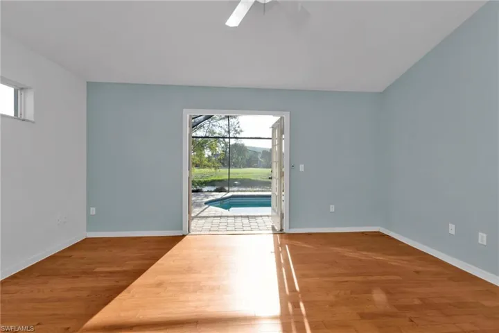 Spare room featuring ceiling fan and wood-type flooring