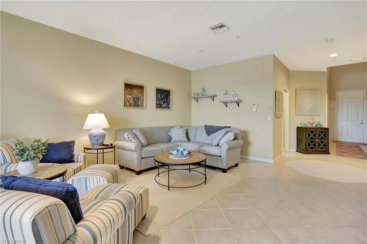 Living room featuring light tile patterned flooring