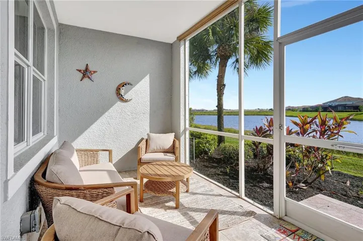 Sunroom / solarium with a water view