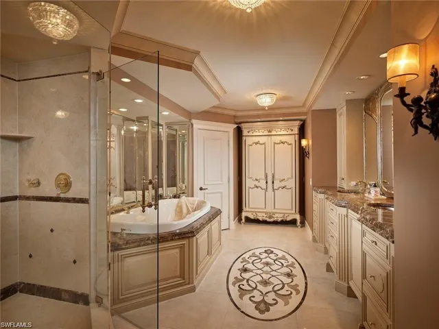 Bathroom with vanity, plus walk in shower, and tile patterned flooring